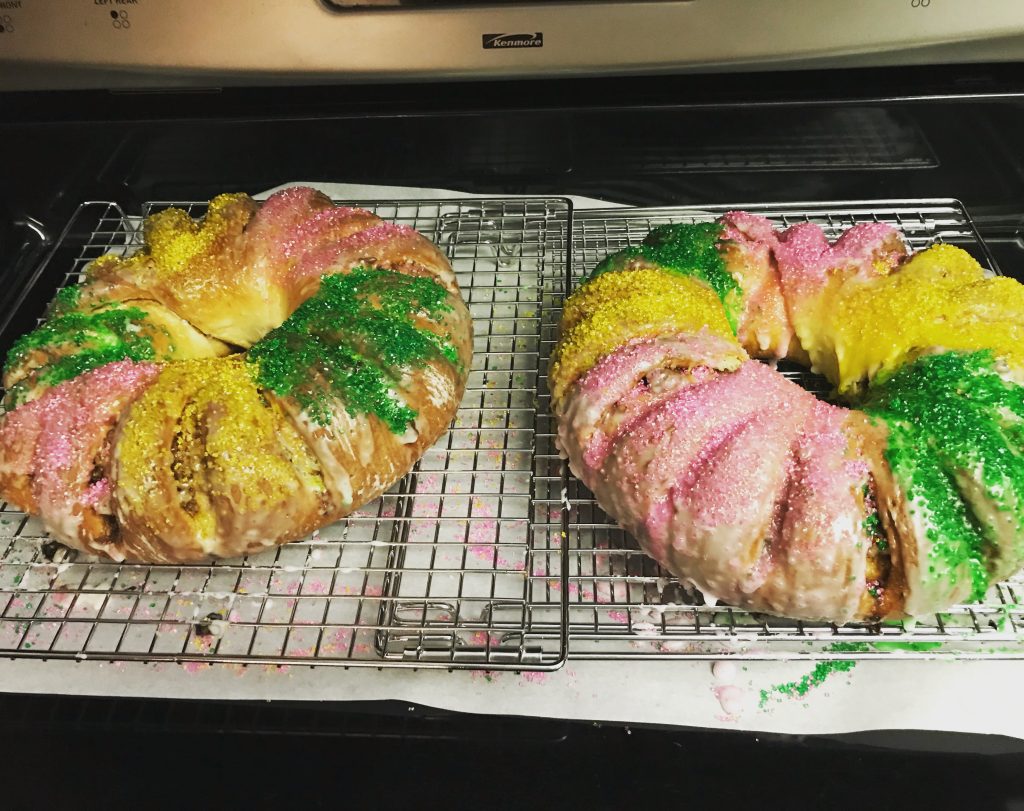 Two Kings' cakes, colourfully decorated with pink, yellow, and green sprinkles.