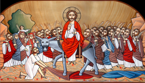A Coptic Icon of the Triumphal Entry: Jesus sits on a donkey that is walking on coats, with palm branches strewn around by the crowd in the background.