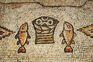 A mosaic of loaves and fish from the floor of the Church of the Multiplication in Tabgha, in the Holy Land.