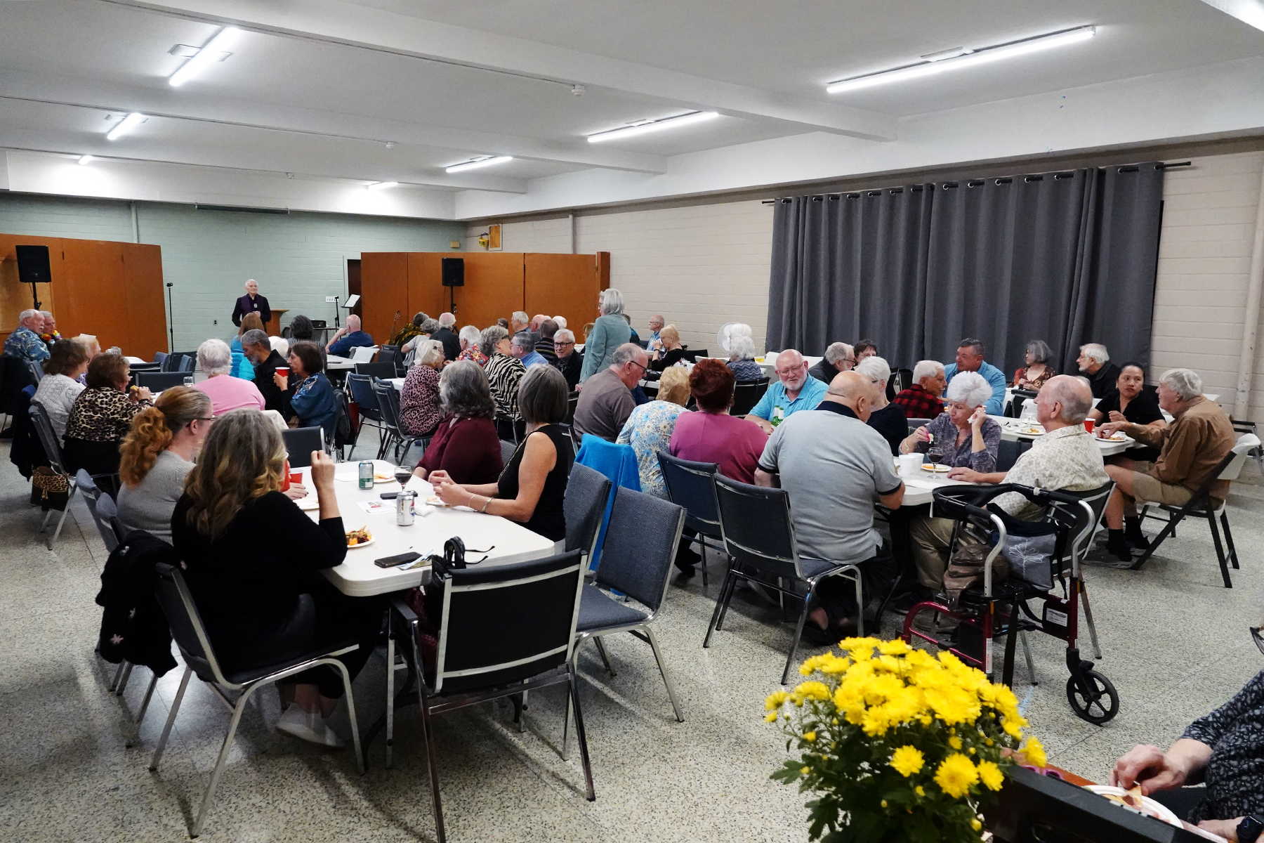 Folk gather in one of the halls for an event