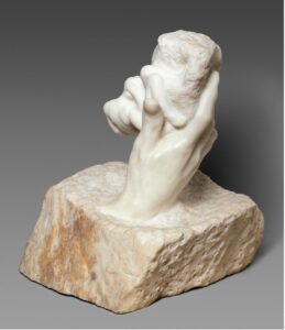 Rodin's sculpture represents God's hand holding the as-yet-inchoate Adam and Eve.